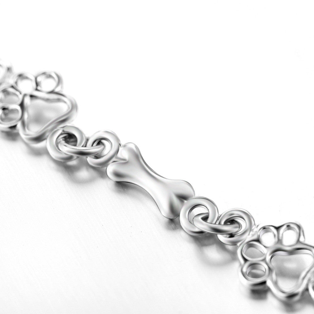 Bracelet en argent avec empreinte de patte et motif os