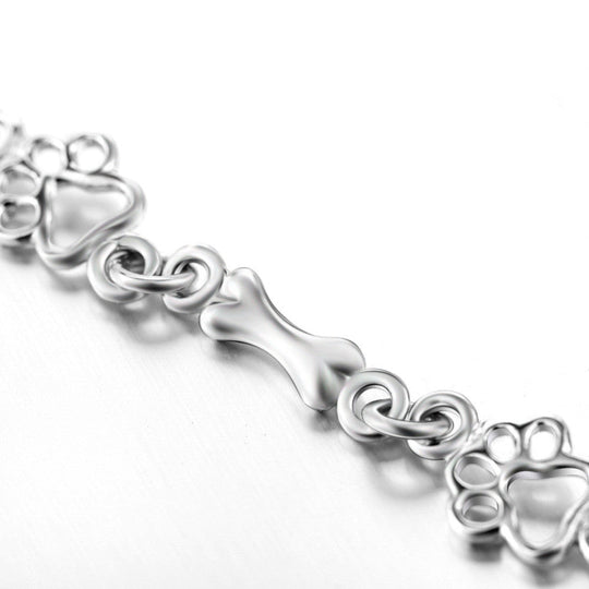 Bracelet en argent avec empreinte de patte et motif os