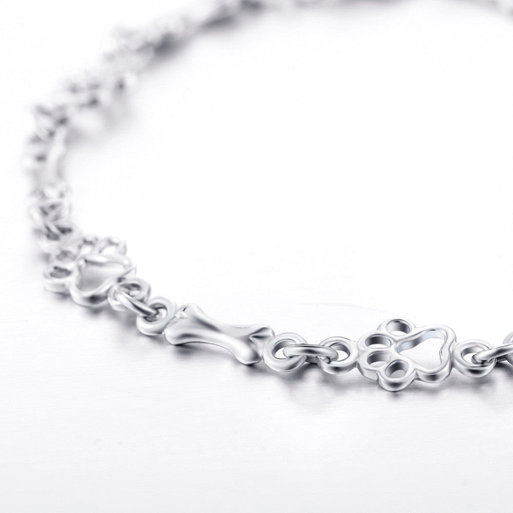Bracelet en argent avec empreinte de patte et motif os