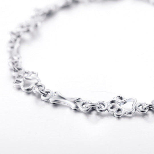 Bracelet en argent avec empreinte de patte et motif os