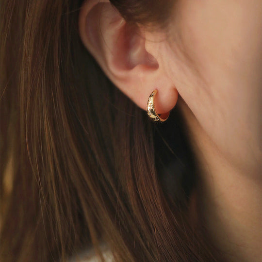 Boucles d'oreilles dorées de luxe motif étoile