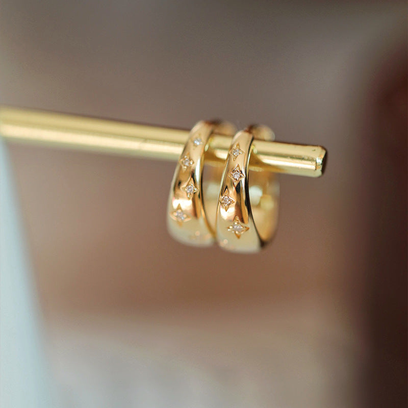 Boucles d'oreilles dorées de luxe motif étoile