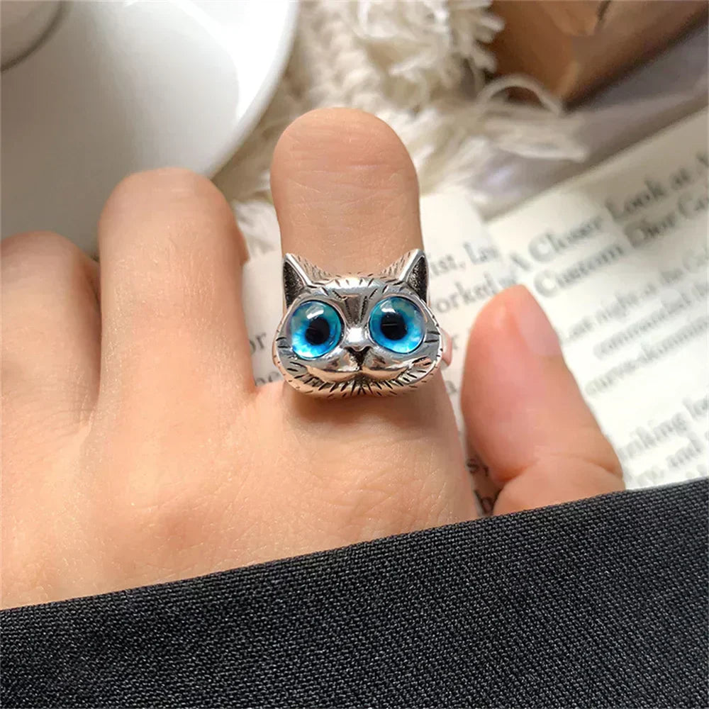 Bague style vintage couleur argent avec yeux de chat bleus