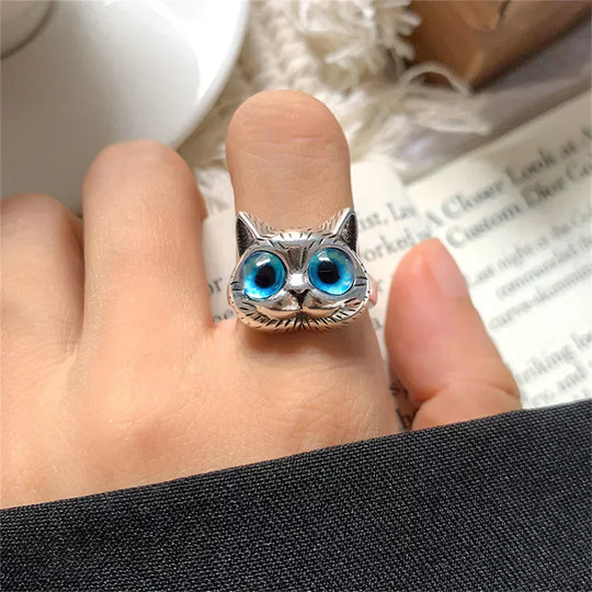 Bague style vintage couleur argent avec yeux de chat bleus