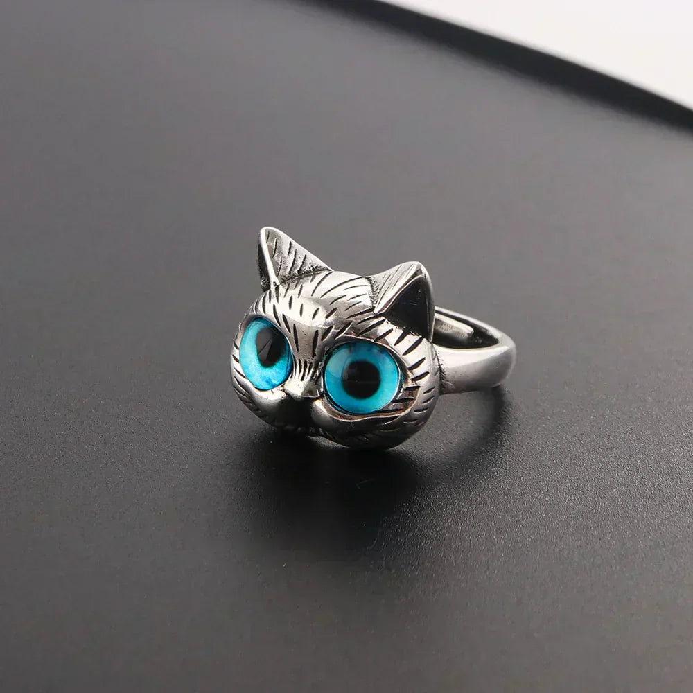 Bague style vintage couleur argent avec yeux de chat bleus