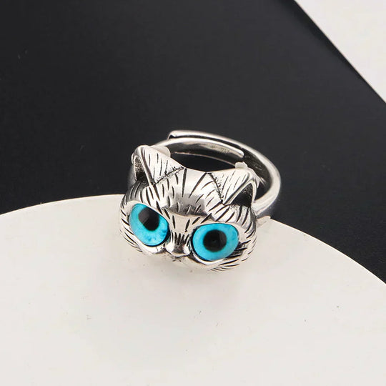 Bague style vintage couleur argent avec yeux de chat bleus