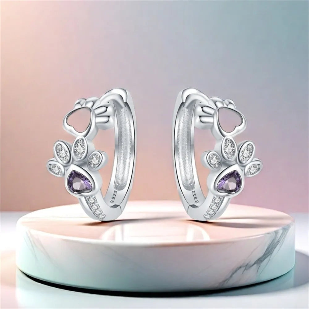 Boucles d'oreilles en argent avec empreinte de patte et zircone cœur