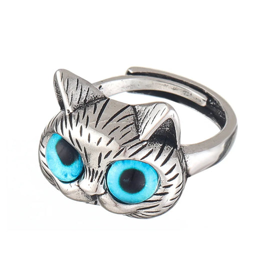 Bague style vintage couleur argent avec yeux de chat bleus