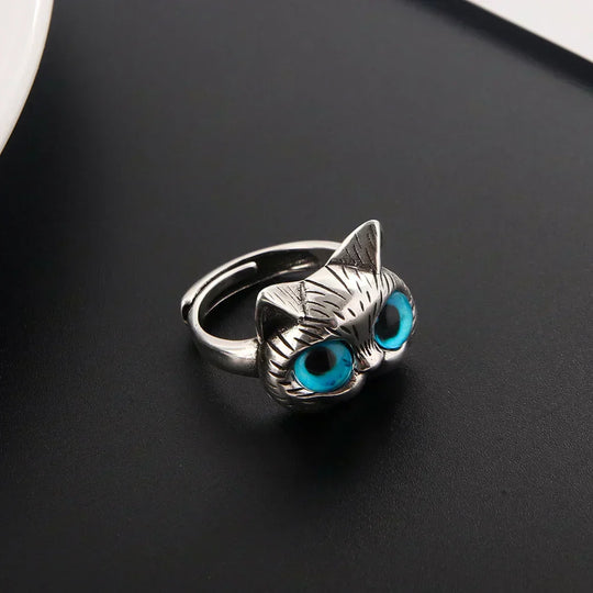 Bague style vintage couleur argent avec yeux de chat bleus