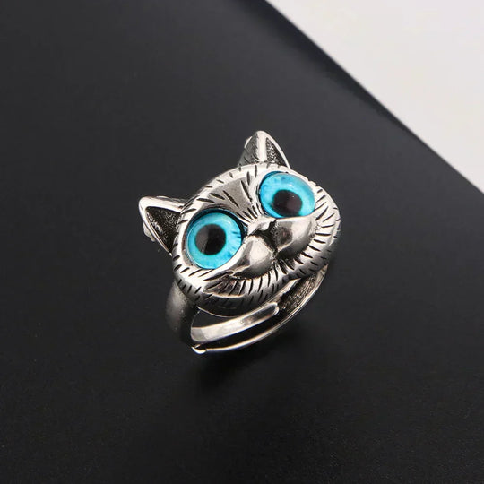 Bague style vintage couleur argent avec yeux de chat bleus